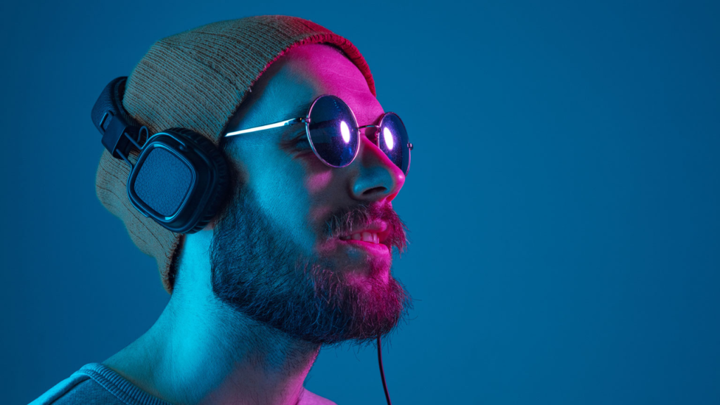 boy wearing cap under headphones