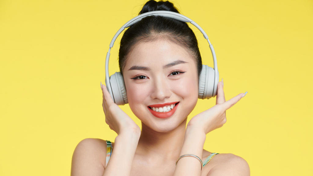 asian girl adjusting her headphones